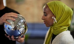 The Guardian's Hibaq Farah gets her eyeball scanned using an orb by cryptocurrency company Worldcoin. (Photograph by David Levene)