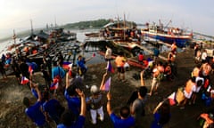 Filipino fishermen and volunteers join civilian-led supply mission to Scarborough shoal in the disputed South China Sea on Wednesday