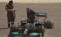 Lewis Hamilton climbs out of his Mercedes after spinning off the track in Bahrain
