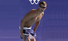 US Michael Phelps changes his swimsuit<br>ATHENS, Greece: US Michael Phelps changes his swimsuit 11 August 2004 at the Olympic Aquatic Center, two days before the beginning of the 2004 Olympic Games. AFP PHOTO TIM CLARY (Photo credit should read TIM CLARY/AFP/Getty Images)