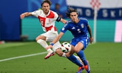 Riccardo Calafiori battles for the ball with Croatia’s Luka Modric during Italy’s dramatic late Euro 2024 win.
