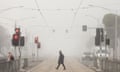 Fog shrouds Flemington Road in Melbourne on Thursday morning