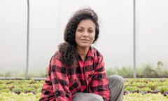 Claire Ratinon crouching among growing salad