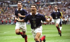 Scotland’s John Collins celebrates after scoring from the penalty spot against Brazil in the opening game of the 1998 World Cup at the Stade de France