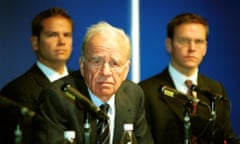 News Corp. Annual General Meeting<br>Rupert Murdoch (center), CEO, News Corp. speaks to the media after the company's annual general meeting in Adelaide, Australia on October 9, 2002. He is flanked by his sons, Lachlan Keith Murdoch (left), Deputy COO, News Corp. and James Murdoch, Executive Vice-President, News Corp. News Corp., which last year had Australia's biggest loss, won't change its earnings forecasts ``at this stage,'' Murdoch said. Photographer: Ian Routledge/ Bloomberg News.