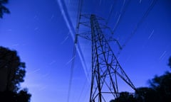 Star trails over an electricity pylon