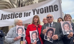 Retired police officer John Murray (second right) outside the Royal Courts of Justice in London in November 2021. 