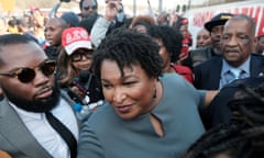 Stacey Abrams speaks with member of the press after crossing the the Edmund Pettus Bridge commemorating the 55th anniversary of the Bloody Sunday march in Selma, Alabama.