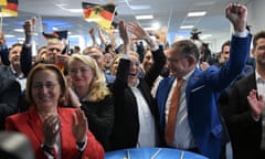 A group of people cheering, some holding Germany flags