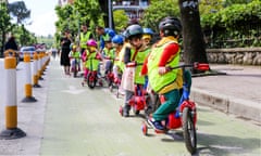 A group of school children on bikes in Albania