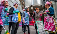 Extinction Rebellion protesters offer ‘teas and greenwash’ outside Lloyd’s of London.