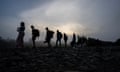 PANAMA-COLOMBIA-US-MIGRATION<br>Migrants walk by the jungle near Bajo Chiquito village, the first border control of the Darien Province in Panama, on September 22, 2023. The clandestine journey through the Darien Gap usually lasts five or six days, at the mercy of all kinds of bad weather. More than 390,000 migrants have entered Panama through this jungle so far this year, far more than in all of 2022, when there were 248,000, according to official Panamanian data. (Photo by Luis ACOSTA / AFP) (Photo by LUIS ACOSTA/AFP via Getty Images) FTAMIGRANTS