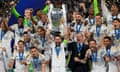 Real Madrid’s Nacho lifts the trophy as he celebrates with teammates after winning the Champions League.
