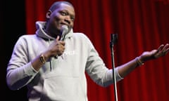 Michael Che on stage at a comedy festival
