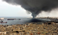 A pall of smoke covers the city of Tripoli, Libya in September 2011. Photograph: Bela Szandelszky / AP