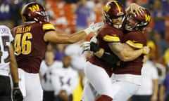 Joey Slye celebrates with Commanders offensive lineman Mason Brooks after making the game winning field goal against the Baltimore Ravens