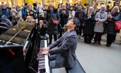 Chinese pianist Lang Lang plays in St Pancras station.