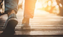 The lower legs of a woman walking