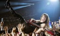 Victoria De Angelis of Måneskin crowdsurfs at the O2.