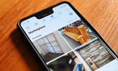 Image of phone on wooden table with online marketplace selling second hand goods open