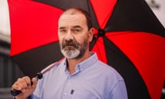 Andy Malkinson with red and black umbrella