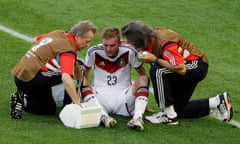 Germany's Christoph Kramer gets assistance during the World Cup final soccer match between Germany and Argentina at the Maracana Stadium in Rio de Janeiro, Brazil, Sunday, July 13, 2014. (AP Photo/Themba Hadebe)