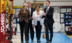 Theresa May at a coach building company in Guildford, August 2017.