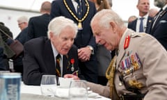 King Charles chats with a D-day veteran at the 80th anniversary commemorations in Normandy