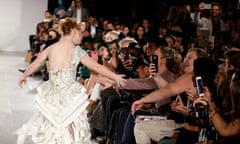 FTL Moda - Runway - New York Fashion Week Spring 2016<br>epa04929598 Australian model Madeline Stuart, who has Down's Syndrome, receives high-fives from spectators as she walks on the runway during the Spring 2016 collection by FTL Moda show during New York Fashion Week in New York, New York, USA, 13 September 2015. The Spring 2016 collections are presented from 10 to 17 September.  EPA/JASON SZENES