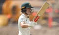 Annabel Sutherland raises her bat after reaching 150 on day two of the Test against South Africa at the Waca Ground.