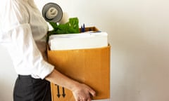 Woman with box full of belongings leaving a job