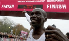 Kenyan Eliud Kipchoge celebrates his unofficial record in Vienna on Saturday. He became the first human to run a marathon under two hours.