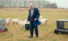 Wilf Davies in field with sheep.