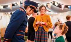 The Station Master and Mrs Brown greet a visitor to The Paddington Bear Experience.