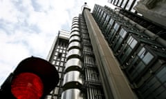 The landmark Lloyds building seen behind a temporary traffic signal.