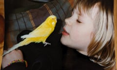 Keza MacDonald and her lutino budgerigar, Brighton Yellow