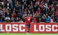 FBL-FRA-LIGUE1-LILLE-MARSEILLE<br>Lille's Canadian forward #09 Jonathan David (C) celebrates after scoring a goal during the French L1 football match between Lille LOSC and Olympique Marseille (OM) at Stade Pierre-Mauroy in Villeneuve-d'Ascq, northern France on April 5, 2024. (Photo by Sameer Al-DOUMY / AFP) (Photo by SAMEER AL-DOUMY/AFP via Getty Images)