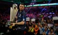 Luke Humphries lifts the trophy after the final of the 2023/4 PDC World Darts Championship against Luke Littler.