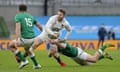 England’s Elliot Daly looks to offload as he is tackled by Ireland’s Jacob Stockdale in Dublin on Saturday.