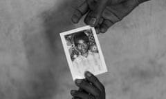 Jeyarani Vaiththeeswaran and her daughter hold a photograph of their missing son and brother Antany.