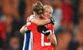 Lia Waelti of Switzerland and Frida Maanum of Norway embrace after the scoreless draw.