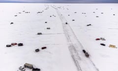 An aerial photo shows The Northwest Angle ice road at Lake of the Woods, between Warroad and Angle Inlet, Minnesota, on January 16, 2022. - The Northwest Angle Ice Road is a 37-mile ice road running across the Lake of the Woods, leading to the northernmost point of the contiguous United States. This is the second year the toll ice road has allowed people to bypass a trip to Canada, or a plane or snowmobile ride, to reach the Northwest Angle fishing community resort.