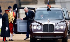 King Charles steps out of one of the royal chauffeur-driven Bentleys