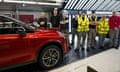 Employees listen as Nissan's president gives a speech at the production plant in Sunderland on 24 November 2023.