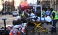 Sydney stabbing: a woman taken to hospital with a stab wound after passersby restrain a man wielding a large knife in Sydney CBD King St attack near Clarence Street