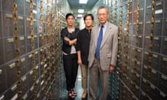 vera jill and thomas sung of abacus federal savings bank standing in a bank vault