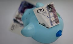Money sticking out of a piggy bank