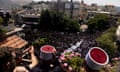 Mourners attend a funeral on Sunday 28 July, held for 10 of the victims of a rocket attack in Majdal Shams, Israeli-occupied Golan Heights.