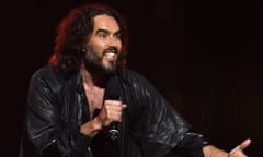 Russell Brand speaks onstage.