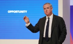Geoffrey Cox speaking at the Conservative party conference in 2018, with the word 'opportunity' projected behind him